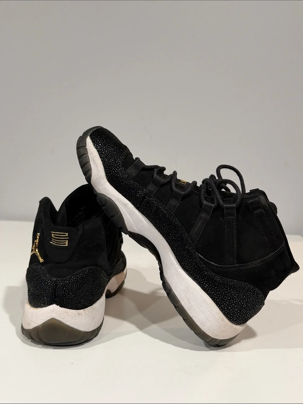 Jordan Black and Gold High-Top Sneakers